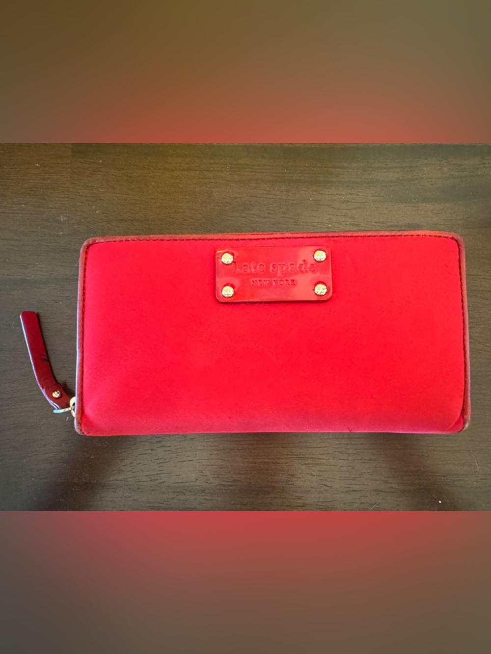 kate spade bright red zip-around wallet with logo plaque